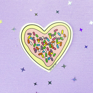 Heart-shaped frosted sugar cookie with sprinkles sticker.